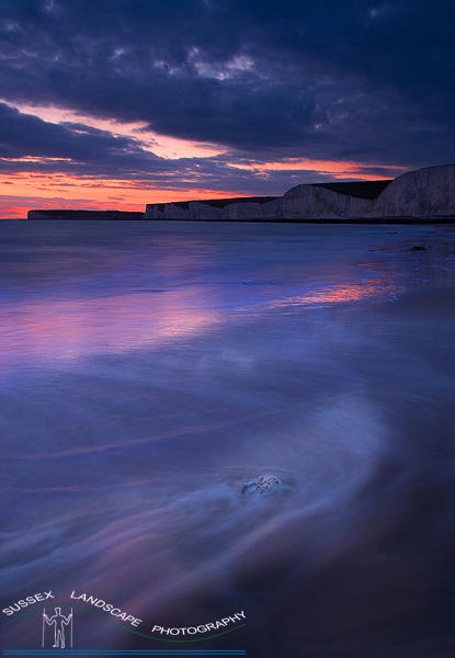 slides/Coastal waters.jpg sussex east birling.gap beach pools tide ocean coast beachy head lighthouse eastbourne rocks water ocean people person clouds storm cliffs pebbles red white blue seven sisters country park panoramic river stream sand ripples Coastal waters